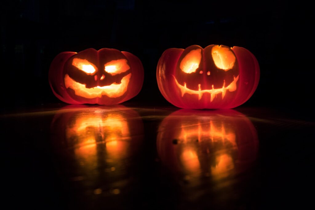 Two spooky carved pumpkins for an article about Halloween in the UK