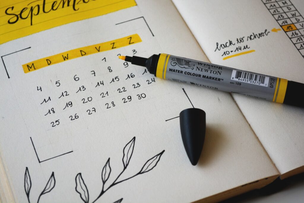 A hand-drawn calendar with a yellow highlighter pen.